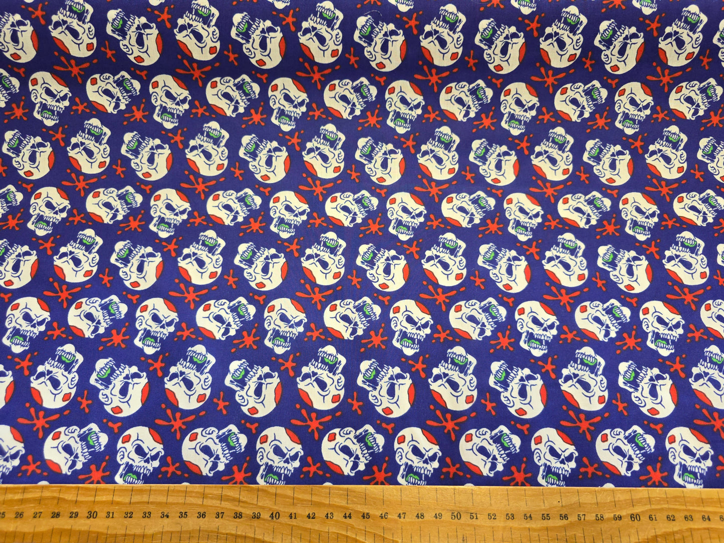 Polycotton Skulls on Blue Fabric - 112cm Width Halloween Craft Material