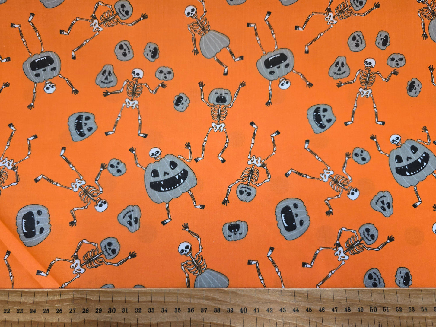 Polycotton Grey Pumpkins and Skeletons on Orange 112cm width