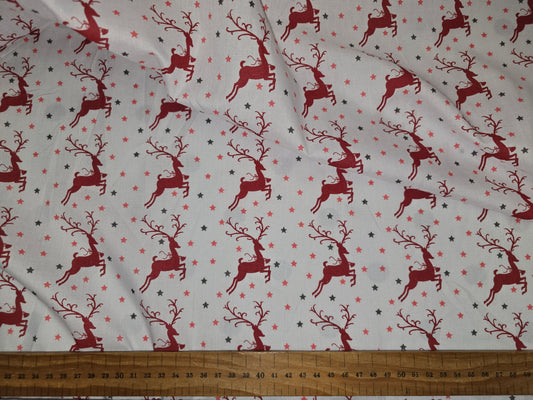 Polycotton Christmas Fabric Leaping Reindeer Red 112cm width