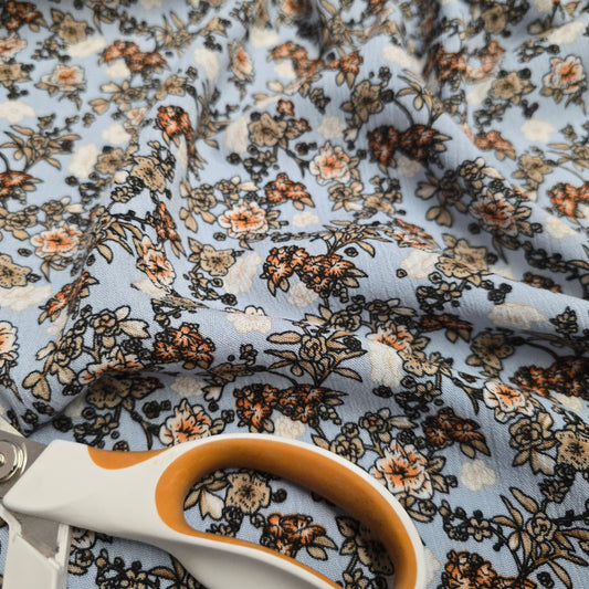 Crinkle Viscose Dress Fabric Beige Brown Orange Flowers on Blue 145cm Width